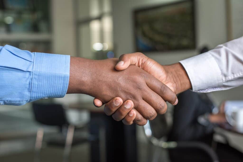 Shaking hands after the commercial real estate deal agreement